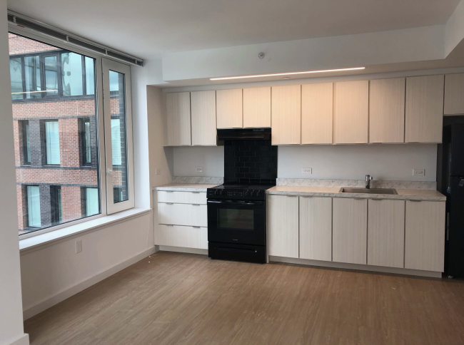 Kitchen at H1H2 with window and stove